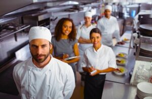 a chef and his team in a cloud kitchen